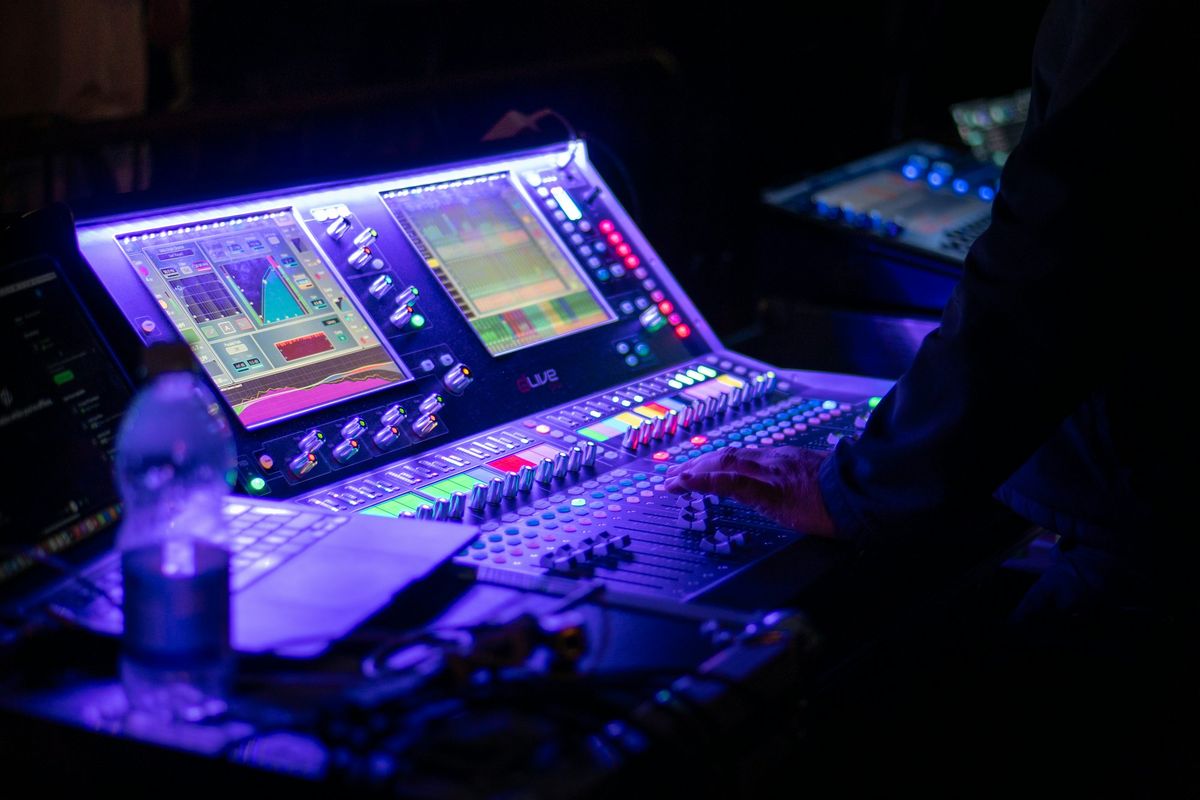 Sound engineer at a digital mixing console